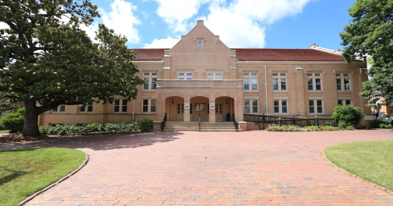 wide front view of the Swain Hall building.